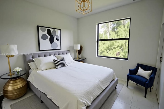 9016 E Justice Cir, La Belle, FL 33935 - bedroom featuring a chandelier and baseboards