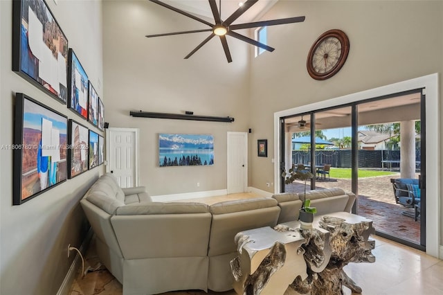 11898 SW 74th Ter, Miami, FL 33183 - living area featuring a towering ceiling, a ceiling fan, and baseboards
