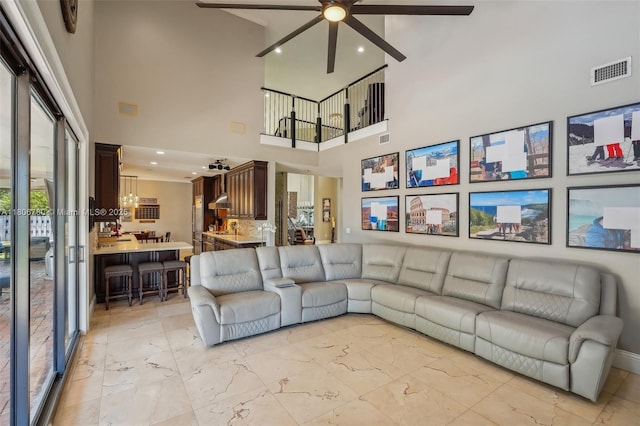 11898 SW 74th Ter, Miami, FL 33183 - living room with a ceiling fan, light marble finish floors, a high ceiling, and recessed lighting