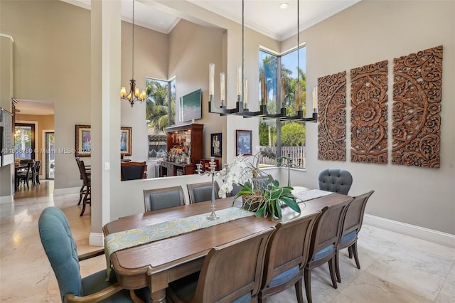 11898 SW 74th Ter, Miami, FL 33183 - dining space with a towering ceiling, a chandelier, baseboards, light marble finish flooring, and plenty of natural light