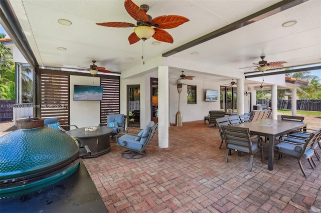 11898 SW 74th Ter, Miami, FL 33183 - view of patio / terrace featuring ceiling fan, outdoor dining space, and a fire pit
