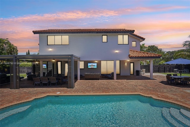 11898 SW 74th Ter, Miami, FL 33183 - back of property featuring a patio area, outdoor dining area, outdoor lounge area, and a tile roof