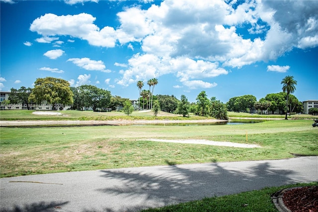 4501 Martinique Way # C1, Coconut Creek, FL 33066 - view of community featuring a water view and a yard