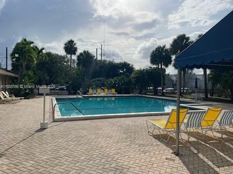 5570 NW 44th St Unit 209A, Lauderhill, FL 33319 - community pool with a patio