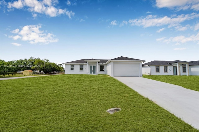 2506 5th St SW, Lehigh Acres, FL 33976 - view of front of house with concrete driveway, a garage, a front lawn, french doors, and stucco siding