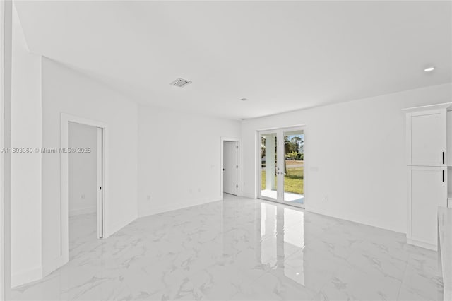 2506 5th St SW, Lehigh Acres, FL 33976 - unfurnished room with light marble finish flooring and baseboards