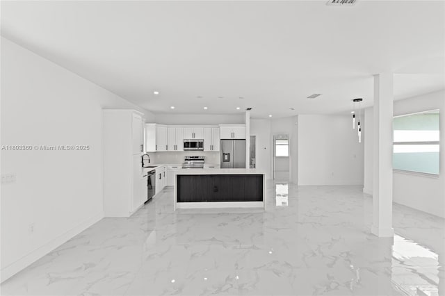 2506 5th St SW, Lehigh Acres, FL 33976 - unfurnished living room with a sink, light marble finish floors, baseboards, and recessed lighting