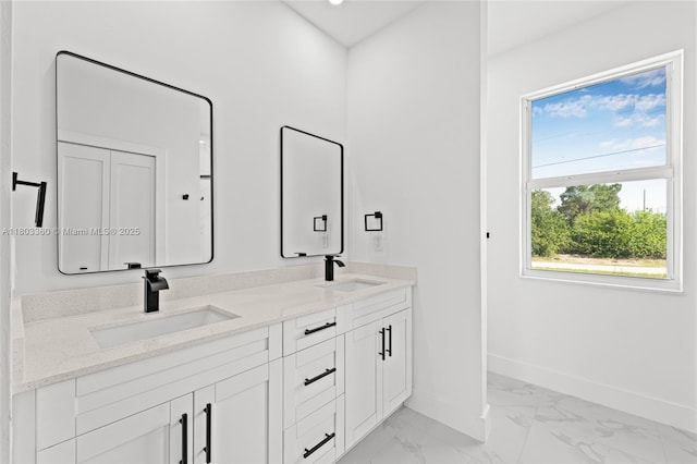 2506 5th St SW, Lehigh Acres, FL 33976 - full bathroom with baseboards, marble finish floors, and double vanity