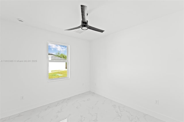2506 5th St SW, Lehigh Acres, FL 33976 - empty room with baseboards, ceiling fan, and light marble finish floors