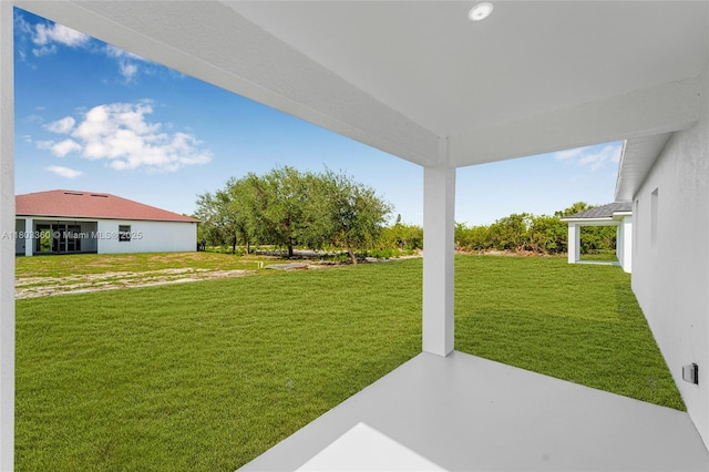 2506 5th St SW, Lehigh Acres, FL 33976 - view of grassy yard featuring a patio area