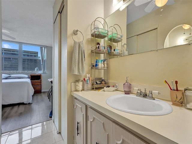 3113 S Ocean Dr Unit 603, Hallandale Beach, FL 33009 - ensuite bathroom with ceiling fan, vanity, and tile patterned floors