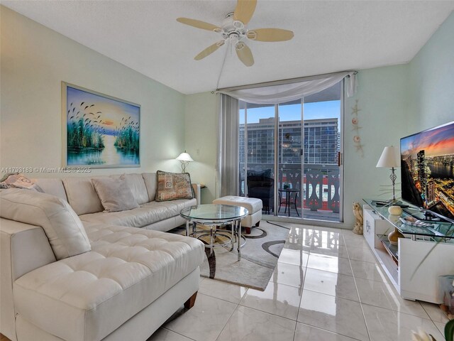 3113 S Ocean Dr Unit 603, Hallandale Beach, FL 33009 - living room with ceiling fan and floor to ceiling windows