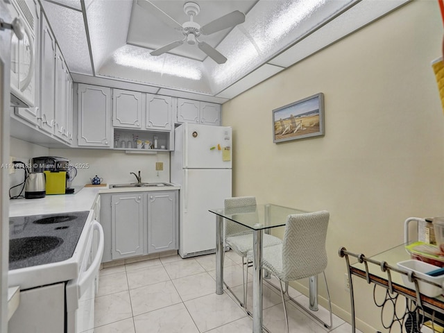 3113 S Ocean Dr Unit 603, Hallandale Beach, FL 33009 - kitchen with white appliances, gray cabinets, ceiling fan, open shelves, and a sink