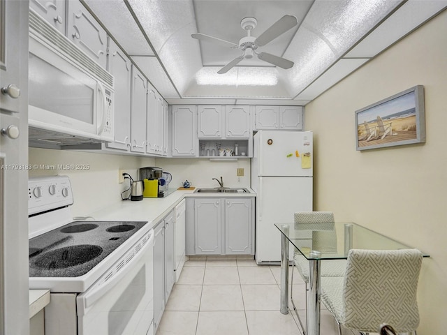 3113 S Ocean Dr Unit 603, Hallandale Beach, FL 33009 - kitchen with white appliances, a sink, a ceiling fan, light tile patterned flooring, and light countertops
