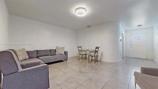 18502 NW 23rd Ct, Miami Gardens, FL 33056 - living room with light tile patterned floors and baseboards