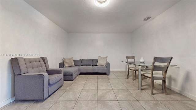 18502 NW 23rd Ct, Miami Gardens, FL 33056 - living room featuring baseboards and light tile patterned floors