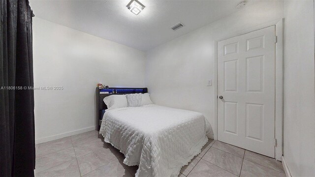 18502 NW 23rd Ct, Miami Gardens, FL 33056 - bedroom featuring light tile patterned floors