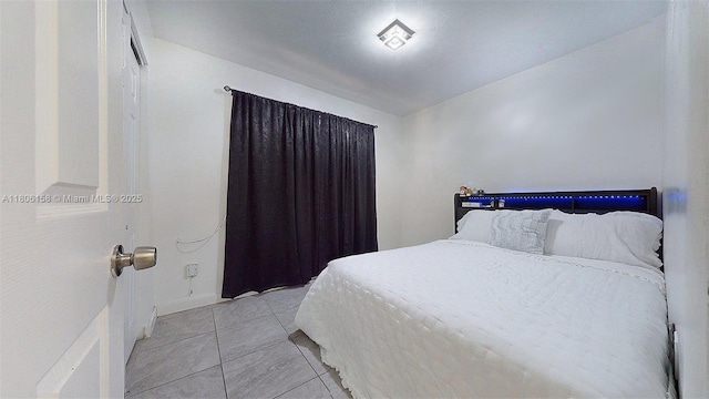 18502 NW 23rd Ct, Miami Gardens, FL 33056 - bedroom with baseboards and light tile patterned floors