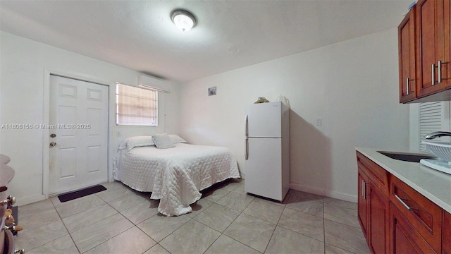 18502 NW 23rd Ct, Miami Gardens, FL 33056 - bedroom with freestanding refrigerator, a wall unit AC, and light tile patterned floors