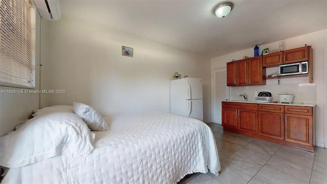 18502 NW 23rd Ct, Miami Gardens, FL 33056 - bedroom with freestanding refrigerator, an AC wall unit, and light tile patterned floors