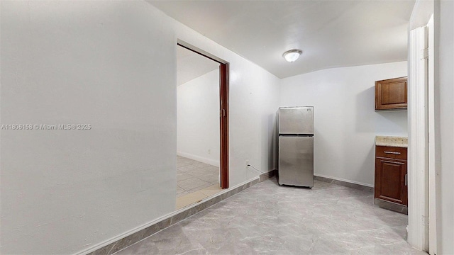18502 NW 23rd Ct, Miami Gardens, FL 33056 - kitchen with freestanding refrigerator and vaulted ceiling