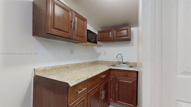 18502 NW 23rd Ct, Miami Gardens, FL 33056 - kitchen featuring a sink and light countertops