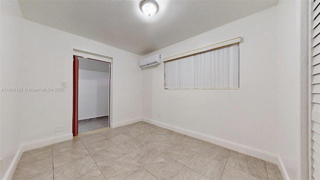 18502 NW 23rd Ct, Miami Gardens, FL 33056 - empty room with a wall mounted AC and baseboards