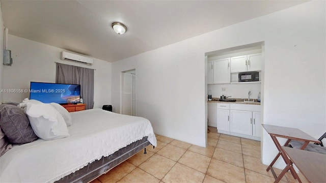 18502 NW 23rd Ct, Miami Gardens, FL 33056 - bedroom with a wall unit AC and light tile patterned floors