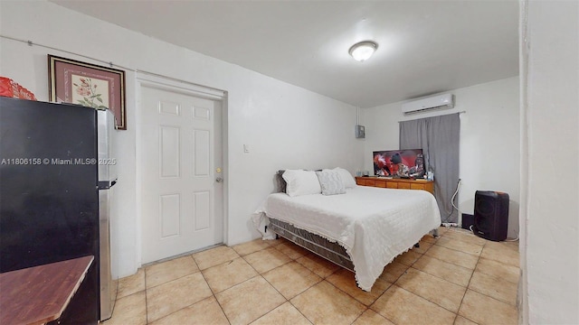 18502 NW 23rd Ct, Miami Gardens, FL 33056 - bedroom featuring freestanding refrigerator, a wall unit AC, and light tile patterned floors