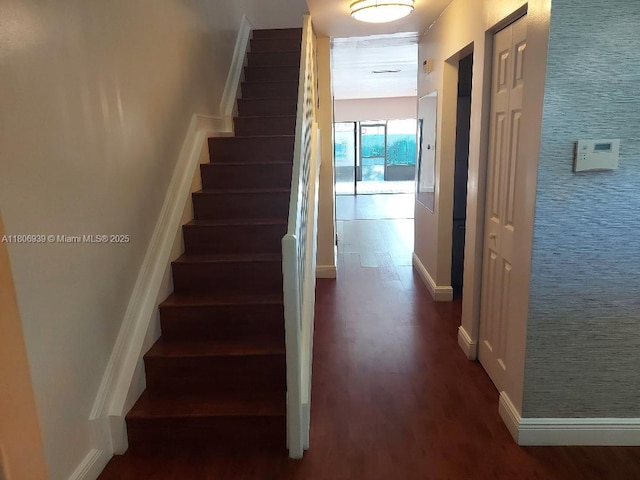 20033 NE 2nd Pl, Miami, FL 33179 - stairs with wood finished floors and baseboards