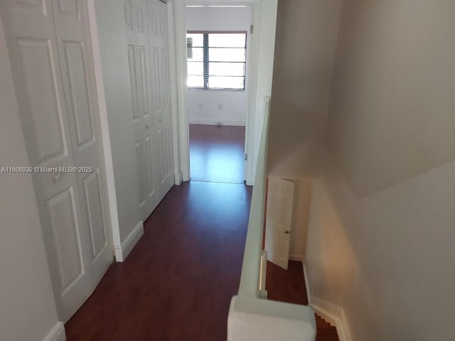 20033 NE 2nd Pl, Miami, FL 33179 - corridor featuring baseboards and dark wood-style flooring