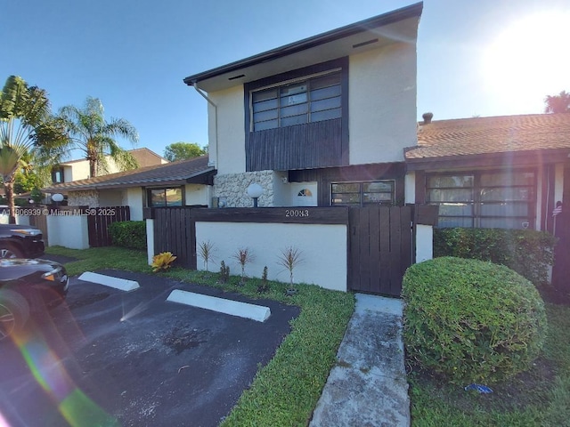 20033 NE 2nd Pl, Miami, FL 33179 - view of front of home with uncovered parking and stucco siding