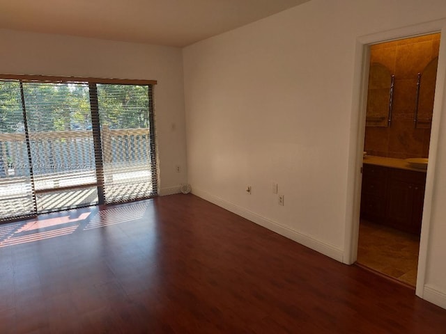 20033 NE 2nd Pl, Miami, FL 33179 - spare room featuring wood finished floors and baseboards