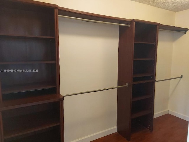 20033 NE 2nd Pl, Miami, FL 33179 - walk in closet featuring dark wood-style floors