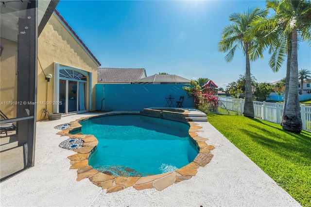 1060 NW 192nd Ave, Pembroke Pines, FL 33029 - view of pool with a fenced backyard, a pool with connected hot tub, and a patio area