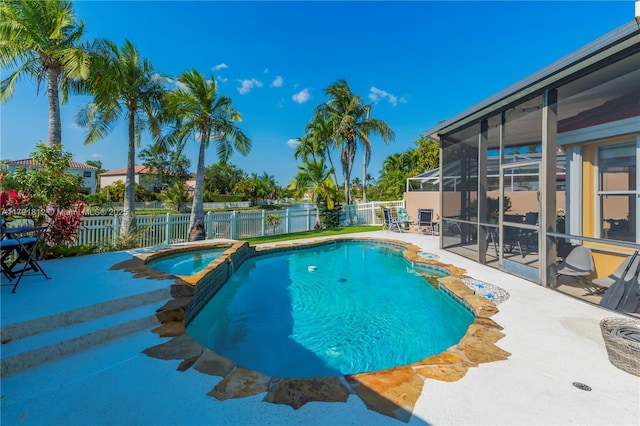 1060 NW 192nd Ave, Pembroke Pines, FL 33029 - view of swimming pool featuring a patio, a fenced backyard, and a pool with connected hot tub