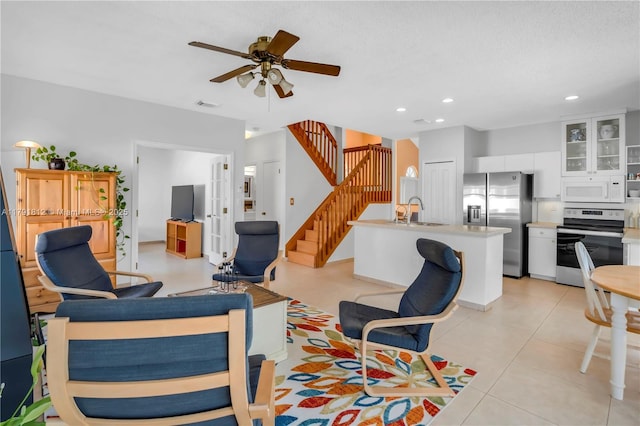 1060 NW 192nd Ave, Pembroke Pines, FL 33029 - living area with a ceiling fan, stairs, and recessed lighting