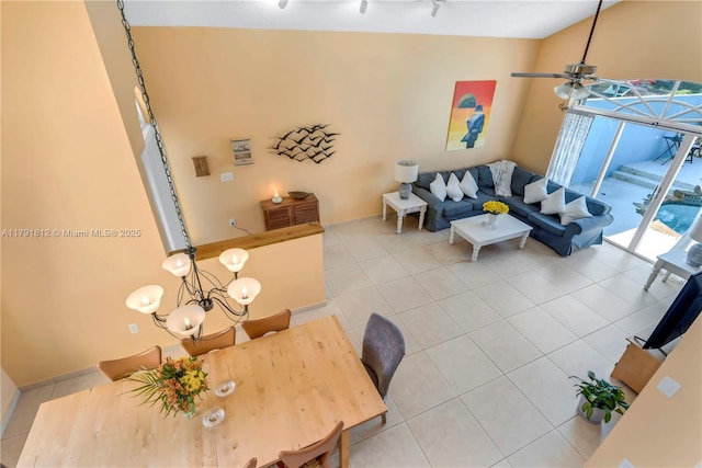 1060 NW 192nd Ave, Pembroke Pines, FL 33029 - living area featuring light tile patterned floors, a chandelier, a ceiling fan, and baseboards