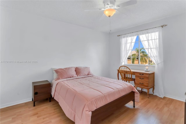 1060 NW 192nd Ave, Pembroke Pines, FL 33029 - bedroom with light wood-style flooring and a ceiling fan