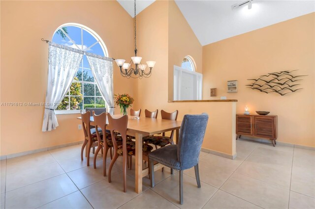 1060 NW 192nd Ave, Pembroke Pines, FL 33029 - dining area with a chandelier, high vaulted ceiling, baseboards, and light tile patterned flooring