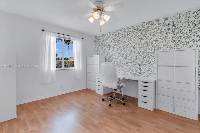 1060 NW 192nd Ave, Pembroke Pines, FL 33029 - office featuring wallpapered walls, an accent wall, light wood-style floors, baseboards, and a ceiling fan