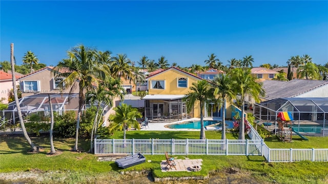 1060 NW 192nd Ave, Pembroke Pines, FL 33029 - rear view of property featuring a fenced backyard, a patio, a residential view, and stucco siding