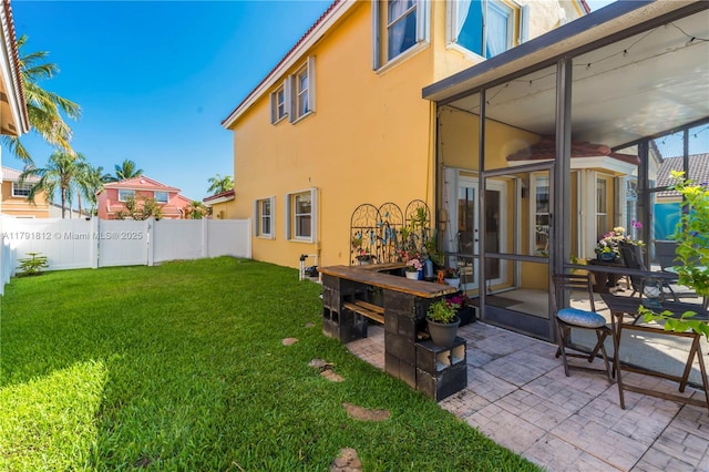 1060 NW 192nd Ave, Pembroke Pines, FL 33029 - rear view of property with stucco siding, a sunroom, and a patio
