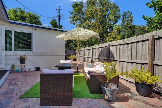 1222 S 14th Ct S, Lake Worth, FL 33460 - fenced backyard with a patio area and outdoor lounge area