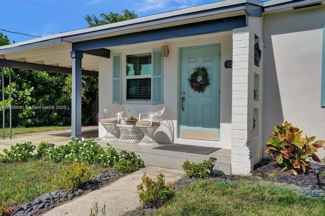 1222 14th Ct S, Lake Worth, FL 33460 - entrance to property with a porch and stucco siding