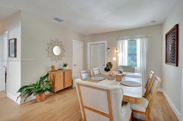 1222 S 14th Ct S, Lake Worth, FL 33460 - dining room with light wood finished floors and baseboards