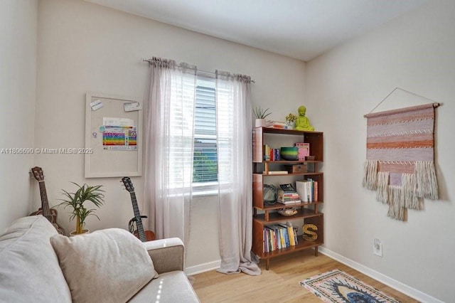 1222 S 14th Ct S, Lake Worth, FL 33460 - sitting room featuring wood finished floors, plenty of natural light, and baseboards