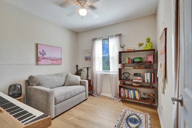 1222 S 14th Ct S, Lake Worth, FL 33460 - living room with wood finished floors, a ceiling fan, and baseboards
