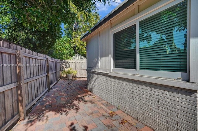 1222 S 14th Ct S, Lake Worth, FL 33460 - view of side of home with a fenced backyard and a patio area