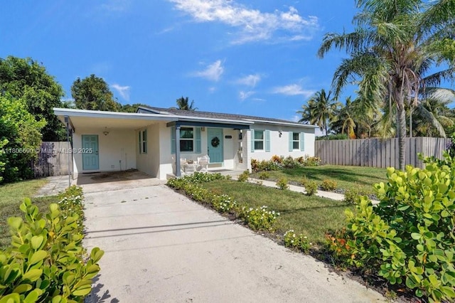 1222 S 14th Ct S, Lake Worth, FL 33460 - ranch-style home with stucco siding, an attached carport, and driveway